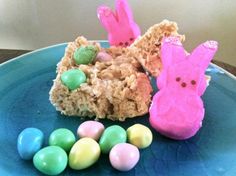 a blue plate topped with an easter treat and candy