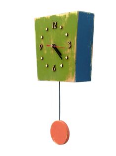 a green and blue clock on a white background