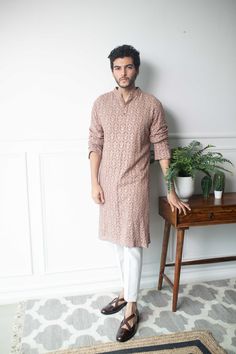 Rose Taupe Kurta Set - Contrast by Parth Rose brown chikankari kurta with pants Included in purchase: Kurta and Pants Product Specification Color: Brown (can be customized) Fabric: Chikankari georgette Occasion: Formal Event, Wedding, Bridal, Reception Style: Kurta Set Designer: Contrast by Parth Care: Dry Clean Only Work: Hand Embroidered ( Variation in color, fabric & detail is possible. Model images are only representative.) This can be customized in any color, size or style of your choice. * Brown Chikankari Kurta, Georgette Chikankari Kurta, Traditional Indian Mens Clothing, Kurta Designs Men's, India Fashion Men, Latest Kurta Designs, Sherwani For Men Wedding, Wedding Kurta For Men, Boys Kurta Design