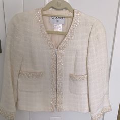 Authentic Vintage Chanel Ivory Blazer With Beautiful Detail. From 99p Collection. Arm Length. Silk Interior Lining. Size 42. But I Would Say Fits More Like A 38/40. Practically Brand New Condition. No Stains, Rips, Pull, Or Smells. A True Unique And Beautiful Piece! Luxury Cream Outerwear For Spring, Designer White Evening Blazer, Designer White Blazer For Fall, Designer White Wedding Blazer, Designer White Spring Blazer, Luxury White Blazer For Spring, Designer Cream Blazer For Spring, Designer White Blazer For Spring, White Designer Blazer For Spring