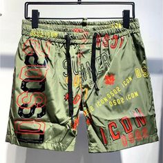 DSQ2 Stickered Quick-Drying Beach Shorts Elevate your wardrobe with these unique DSQ2 Stickered Quick-Drying Beach Shorts that brings not only comfort but style to your wardrobe. We mean unique in more sense than one, a unique labeled color scheme paired with a drawstring look to give you style, comfort, and an amazing look. These printed shorts are designed with a quick-drying fabrication, which makes it stylish and comfortable, after taking a dip in the pool. Product Details: Polyester Beach S Mens Sweat Suits, Military Hoodie, Mens Fashion Outfits, Streetwear Jackets, Outdoor Sportswear, Tracksuit Men, Running Shorts Men, Mens Shorts Summer, Stylish Men Casual