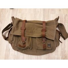 Main Material: Use Of High-Quality Cotton Canvas, High-Quality Imported First Layer Of Leather And Bronze Metal Structure: A Total Of Six Pockets, One Main Pocket, Outside There Are: Two Front Pockets, A Zippered Back Pocket; Inside: A Zipper Pocket, Dimensions:' You Can Put 15-Inch Laptop Capacity: 10l Weight: 1 Kg Features: Design Retro Minimalist Design, With Thick Shoulder Strap Handle, More Comfortable This Bag Will Meet All Your Requirements, And It Look Absolutely Perfect. You Will Like I Khaki Leather Satchel With Adjustable Strap, Everyday Use Large Capacity Flap Satchel, Large Capacity Leather Bag In Khaki, Large Capacity Khaki Leather Bag, Casual Leather Flap Bag With Large Capacity, Large Capacity Flap Bag For Everyday Use, Khaki Satchel With Leather Handles, Khaki Leather Shoulder Bag With Pockets, Brown Flap Bags For Outdoor Use