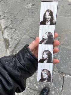 a person holding up an old photo in their left hand and another one with her mouth open