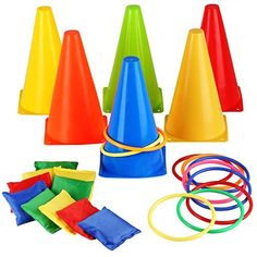 an assortment of colorful plastic cones, rings and hoop tossers on a white background