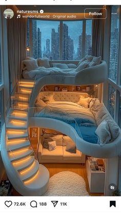 a bedroom with a spiral staircase leading up to the bed in front of a window