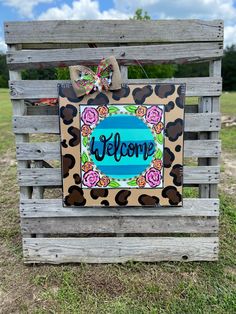 a welcome sign is placed on a pallet