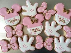 minnie mouse cookies are arranged in the shape of hearts and hands with name on them