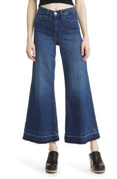 Made from superstretchy denim, these '70s-inspired palazzo jeans are remade for today with released hems and a slightly shorter inseam. 28 1/2" inseam; 28" leg opening; 12" front rise; 15" back rise (size 29) Zip fly with button closure Five-pocket style 77% cotton, 18% modal, 4% elasterell-p, 1% elastane Machine wash, dry flat Made in Turkey Summer Wide-leg Flares With Frayed Hem, Fall Wide-leg Flares With Frayed Hem, Fall Wide Leg Flares With Frayed Hem, Spring Dark Wash Cotton Flares, Spring Denim Blue Flares With Frayed Hem, Spring Medium Wash Wide Leg Flares, Spring Dark Wash Wide Leg Flares, Spring Dark Wash Flares With Five Pockets, Crop Wide Leg Jeans