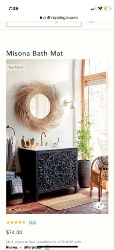 a bathroom with a sink, mirror and rugs on the floor in front of it