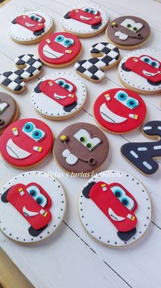 decorated cookies are arranged on a table