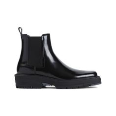 Givenchy Chelsea boots are crafted from polished black calf leather, presenting a chic ankle-length silhouette. This elegant footwear incorporates elasticated side panels for ease and a leather pull-tab for effortless wear. The black rubber outsole adds a modern touch to the overall design.

- Gender: Man  
- Material: Black calf leather  
- Type: Boots  
- Features: Elasticated panels, leather pull-tab, branded insole Calf Leather Boots, Givenchy Boots, Leather Boots Black, Givenchy Man, Leather Chelsea Boots, Leather Cap, Leather Pulls, Black Leather Boots, Black Rubber