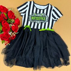 Sold Out Everywhere And Only Available Here! Brand New With Tags Girls Beetlejuice Tutu Dress I Have Only Two Of These Cuties, Both Are Size Medium Which Fits Girls 7-8 Black And White Striped Referee Style Stretch Bodice With Logo On Front Rounded Neckline Short Sleeves Black Mesh Attached Layered Tutu Skirt With Black Stretch Skirt Lining Underneath Green Ribbons At Waistline Super Cute For Dress Up, Parties, Cosplay, Halloween And More! Cotton/Spandex/Poly See My Posh Shop For Beauties From S Playful Black Dress For Costume Party, Beetlejuice Dress, Layered Tutu Skirt, Summer Tank Dress, Skirt Lining, Pink Tutu, Cosplay Halloween, Stretch Skirt, Long Sleeve Floral Dress