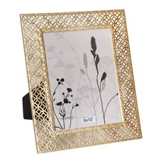 a gold metal frame with flowers on it