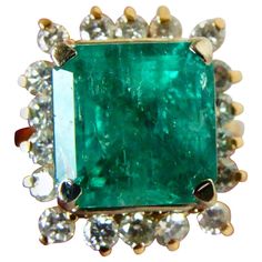 7.60 Carat Natural Colombian Emerald & Diamond Ring The Mounting is Custom Made of Solid 14K Yellow Gold Center with a Fine Natural Colombian Emerald Square Cut 6.50 Carat (10.17 x 10.17 x 8.58mm). Medium Green, Fully Saturated Very Good Clarity & Transparency. Surrounded by Natural Round Brilliant Cut Diamonds 1.10 Carat, Clarity SI1-SI2/ Color G. Total Ring Weight 8.26g Ring Size 6 Pre-Owned-Excellent Condition Columbian Emeralds, Victorian Engagement Rings, Emerald Rings, Pear Shaped Ring, Green Emerald Ring, Emerald And Diamond Ring, Emerald Diamond Ring, Beading Ideas, Colombian Emeralds