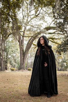 This cloak is the perfect costume accessory for any cosplay, LARP, DC or Wonder Woman event. Has a black faux fur trim and the hood is larger than our regular hooded cloaks. Three sizes: Small (Kids - 30" long), Medium Adult - 48", Large adult - 58". #celticgirl #cosplaygirl #valkyrie #viking #vikings #warrior #nordic #warriorspirit #warriormindset #warriorsoul #berserker  #medieval  #fantasy #fantasyphotography #larpmodel  #larpspain #larpcostume #cosplay #larping #larplife #robinhood #archer Black Winter Costumes For Fantasy Events, Black Vampire Costume For Winter, Vampire Cape For Winter Costume Party, Vampire Style Cape For Costume Party And Winter, Vampire Style Cape For Costume Party In Winter, Vampire Cape For Costume Party In Winter, Winter Fantasy Black Cosplay Costume, Black Fantasy Cosplay Costume For Winter, Black Cosplay Costume For Fantasy Events In Winter