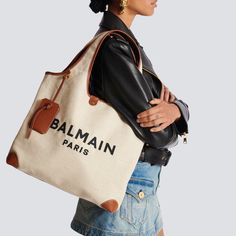 The B-Army Grocery Large Canvas And Leather Bag is the perfect combination of style and functionality. Made with durable canvas and genuine leather, this bag is designed to withstand the rigors of everyday use. With its spacious interior, it easily holds all your essentials while keeping them organized. Stay effortlessly chic and organized with this must-have bag. Balmain Bag, Grocery Tote Bag, Grocery Tote, Backpack Travel Bag, Bags Logo, Embroidered Bag, See By Chloe, Leather Care, Grocery Bag