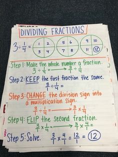 a piece of paper with numbers and fractions written in different colors on it, next to a calculator