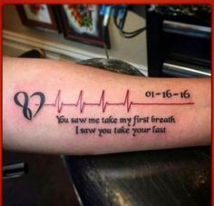 a person with a heartbeat tattoo on their arm