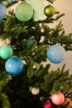 a christmas tree with ornaments hanging from it