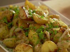 a white plate topped with potatoes and onions