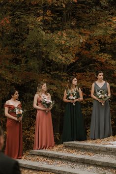 the bridesmaids are waiting on the steps to get ready for their wedding ceremony