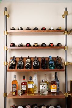 the shelves are filled with bottles of liquor