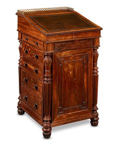 an old fashioned wooden desk with drawers