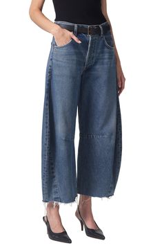 A superhigh waist and structured, curved wide legs cut a chic silhouette in these oversized, raw-cropped jeans crafted from nonstretch denim. 26" inseam; 21" leg opening; 13" front rise; 16" back rise (size 29)
 Button fly Five-pocket style 100% cotton Machine wash, tumble dry Made in the USA import of fabrics Spring Wide Leg Deconstructed Jeans, Modern Rigid Denim Cropped Bottoms, Wide Leg Deconstructed Denim Jeans, Modern Wide Leg Cropped Jeans, Modern Cropped Rigid Denim Bottoms, Chic Wide Leg Cropped Jeans With Belt Loops, Casual Wide Leg Deconstructed Bottoms, Wide Leg Cropped Jeans With Belt Loops For Spring, Modern Wide Leg Cropped Jeans For Spring