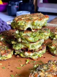 broccoli fritters stacked on top of each other with cheese and seasoning