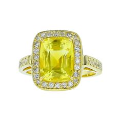 Constructed from 18K yellow gold, this modern ring features a striking primary gemstone of yellow sapphire and a secondary gemstone of diamonds, with a total carat weight of 6.08. Diamond Halo Ring, Modern Ring, Halo Diamond Ring, Yellow Sapphire, Halo Ring, Halo Rings, Diamond Halo, Gold Yellow, Halo Diamond