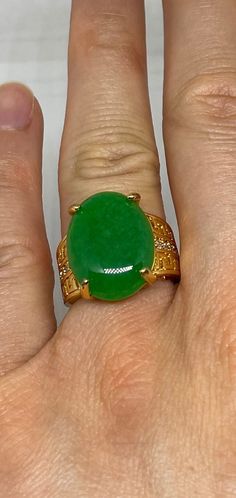 "Vintage Lucky Green Nephrite Jade ring Large green nephrite jade  Ornate gold finished White bronze Vintage ring, does not tarnish, NOT sterling Size 6.5,or  7 ONLY  My jeweler can custom re size for a $20 fee  All rings are shipped free in the US in a nice gift box.   Check out our over a THOUSAND great reviews Engraving is $4 per letter and is not always perfect depending on the piece. It can take a few days if the jeweler is busy. This is payable to Paypal Judithsltd@gmail.com This is \"fun Jade And Gold Jewelry, Green Signet Ring With Oval Cabochon Gemstone, Green Oval Cabochon Signet Ring, Green Oval Cabochon Gemstone Signet Ring, Gold Oval Chrysoprase Emerald Ring, Green Oval Cabochon Signet Ring For Gift, Green Oval Cabochon Signet Ring As Gift, Green Jade Spiritual Rings, Spiritual Green Jade Rings