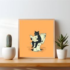 a black cat sitting on top of a toilet reading a newspaper next to a cactus