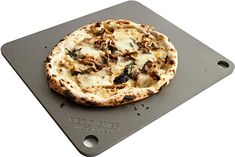 a pizza sitting on top of a metal tray