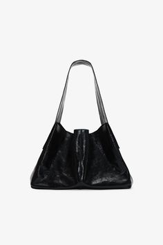 Take on the world with our Brenna Crossbody Tote, a handcrafted carryall in either pebbled (Disco) or distressed crinkled (Onyx) European leather. Her slouchy rectangular shape is all the more enduring thanks to a structured bottom and wide crossbody strap. Oversized with a roomy main compartment and magnetic button fastening, she's a trusty staple for your everyday. | Mily is shown modeling Brenna in Onyx. Astrid is shown with disco pebble. Total length is approximately 19" (49 cm).100% Europea Chic Everyday Bag With Textured Finish, Chic Textured Everyday Bag, Evening Leather Bag With Textured Finish, Leather Bag With Textured Finish For Evening, Everyday Rectangular Shoulder Bag With Textured Finish, Textured Leather Bag For Evening, Everyday Textured Finish Bags, Everyday Leather Bag With Textured Finish, Everyday Rectangular Textured Bag