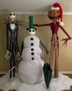 three halloween decorations made to look like snowmen