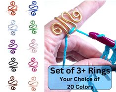 a hand holding a crochet hook with the text set of 3 rings your choice of 20 colors