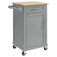 a blue kitchen cart with a wooden top and two drawers on casteors, sitting against a gray background