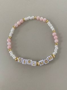 -baby pink and gold combination bracelet. -Personalize what you would like the letters to say! -One bracelet sold for each order. Order more bracelets to stack! Check out the other designs we include! -Gold beads are made with 14k gold plated beads. -Each bracelet comes with a sunset stamped charm If you have a color combination you would like that you don't see, message me and we can see if I can fulfill the request based on materials! Cheap Pink Bracelets With Custom Name, Cheap Adjustable Pink Name Bracelet, Trendy White Letter Jewelry, Trendy White Letter Shaped Jewelry, Personalized Pink Bracelets For Gifts, Personalized Pink Bracelets As Personalized Gift, Trendy White Jewelry With Letter Print, Cute Gold Stretch Bracelet With Letter Beads, Adjustable Pink Jewelry With Letter Print