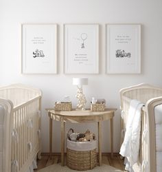 three posters on the wall in a baby's room with two cribs