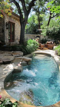 an outdoor swimming pool in the middle of a yard