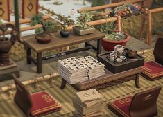 a room filled with tables and chairs covered in books next to potted plants on top of them