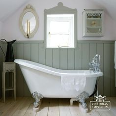 an old fashioned claw foot bathtub in a bathroom