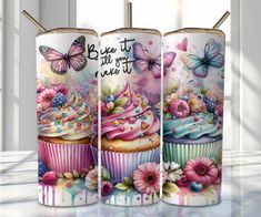 three colorful cupcakes with flowers and butterflies on them are next to each other