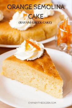 a slice of orange semolina cake on a white plate with whipped cream and an orange garnish