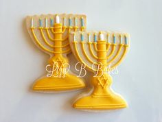 two decorated cookies in the shape of menorah