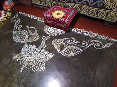 the table is covered with intricately designed designs on it's surface, along with other decorative items