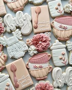 decorated cookies with pink and white icing on a table