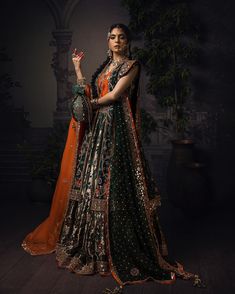 Green Lehenga with Choli and Open Gown Bridal Dress is a Traditional masterpiece adorned with Hand-crafted embellishments and Luxury designs. Custom sizes. Lehenga Designs For Women, Green Pakistani Bridal Dress, Green Bridal Lehenga, Skirt Lehenga, New Lehenga, Bridal Mehndi Dresses, Pakistani Bridal Dress, Choli Dress, Mehendi Outfits