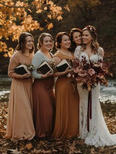 the bridesmaids are all dressed in different colors