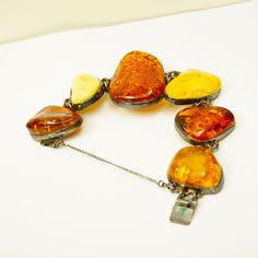 BOLD AMBER BRACELET Set In 925 Silver - Heavy Jewelry - Freeform Raw Stones - Luxury Unisex Gift For Amber Lovers - Rare Statement Piece. Chunky vintage Butterscotch & Honey & Cognac Baltic amber and 925 Sterling Silver bracelet. Freeform raw amber stones. Unisex bracelet with safety chain. Weight:  68 grams. Chunky bracelet. Amber from Poland. Measurements:   Length 8". Comfortable fit to the wrist 7.5" around. Biggest amber: 1.75" x 1.5" x 1/2" deep. Bold, beautiful quality jewelry with striki Vintage Amber Jewelry, Amber Bracelet, Chunky Bracelets, Natural Amber, Amber Stone, Unisex Bracelets, Amber Jewelry, Unisex Gifts, Raw Stone